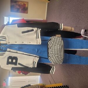 Black and White Varsity Jacket with Blue Pants